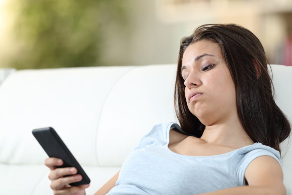 woman bored on a dating app